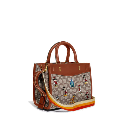 Coach Women's Disney X Coach Rogue 25 In Signature Textile Jacquard With Mickey Mouse And Friends Embroidery Brass/Cocoa Burnished Amber Multi