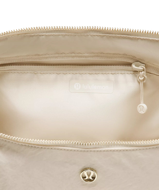 lululemon Unisex Slouchy Sling Bag 6L Metal Hardware Light Ivory/Gold