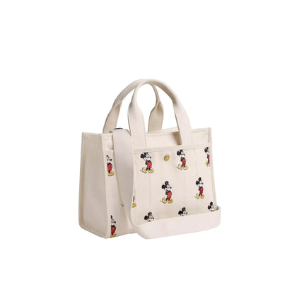 Coach Women's Disney X Coach Cargo Tote Bag 26 With Mickey Mouse In Regenerative Cotton Canvas Brass/Ivory Multi